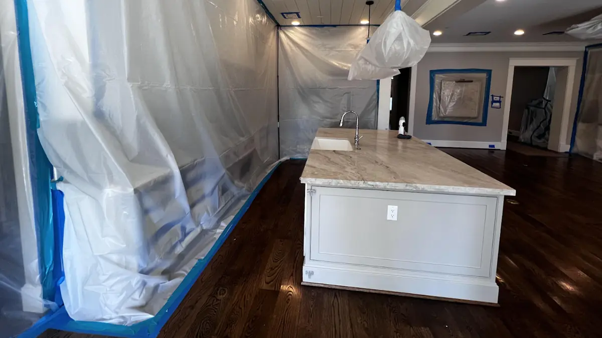 Kitchen sealed with containment sheeting