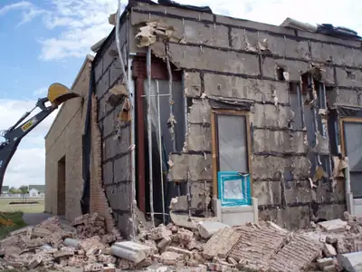 Partially demolished brick building