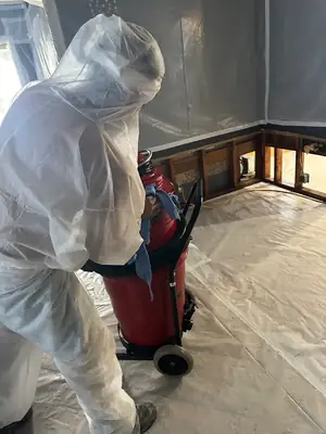 Technician in a protective suit