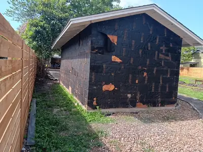 Side of a house during abatement work