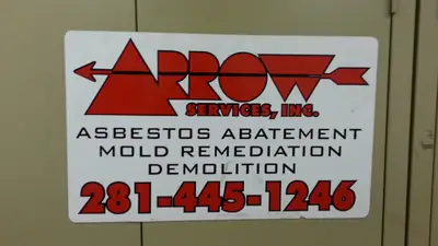 Arrow Services Inc sign listing asbestos abatement, mold remediation and demolition
