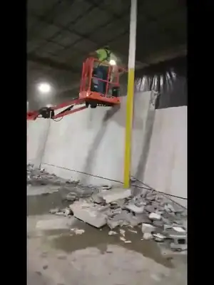 Worker on a lift inside a building