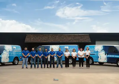 AST Cleaning & Restoration team and vans