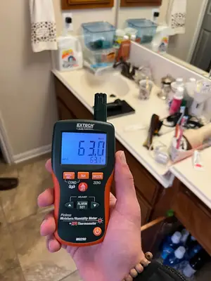 Moisture meter reading in a bathroom