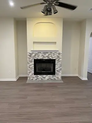 Living room with a fireplace after work