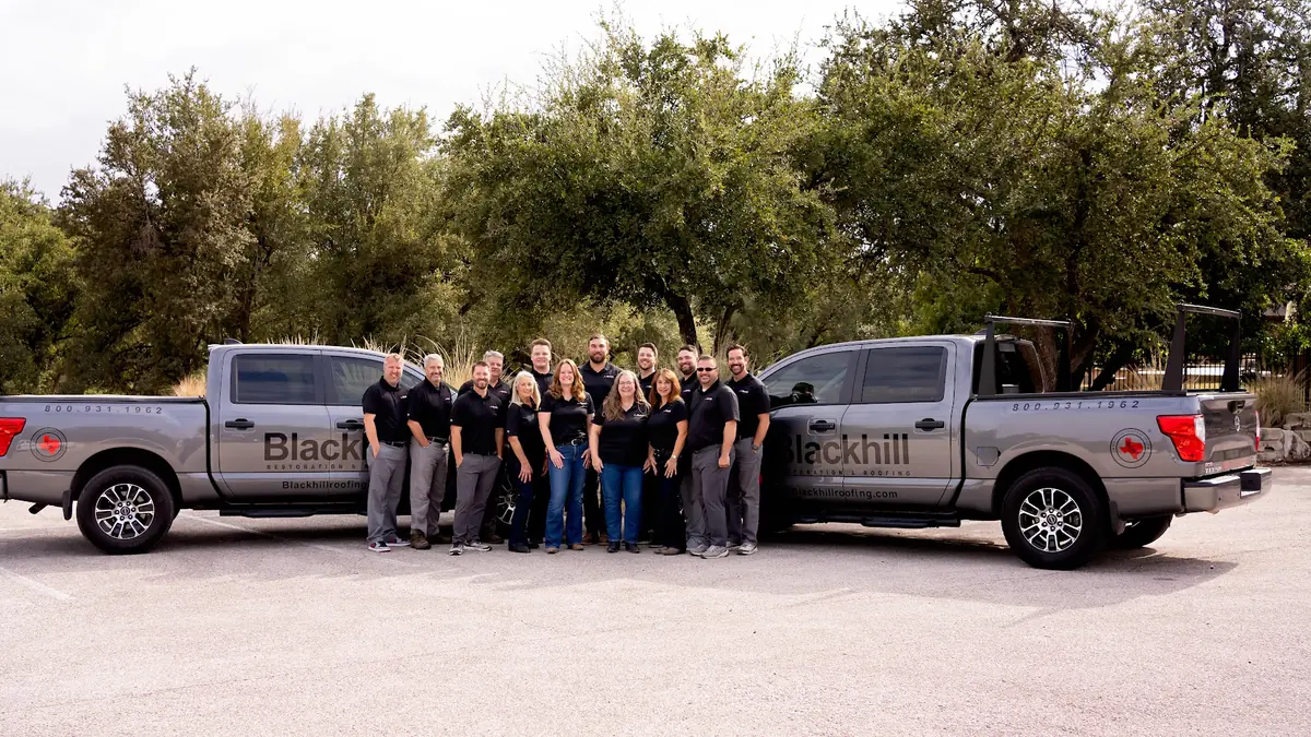 The Blackhill Restoration team with company trucks