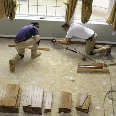 Crew removing damaged flooring