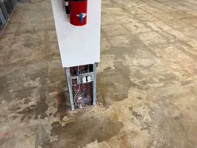 Damaged flooring along a wall after water exposure