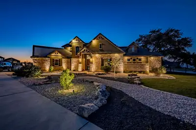 Landscaped home at dusk