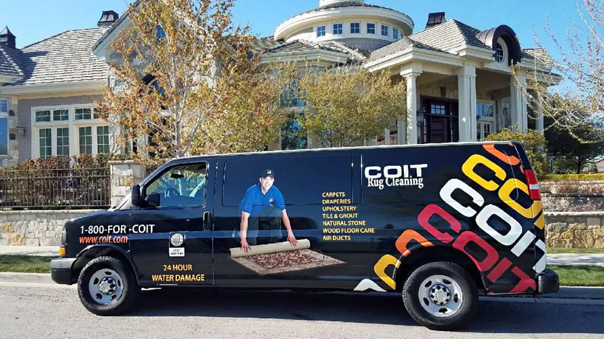 COIT branded van outside a home