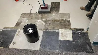 Floor tiles lifted during abatement