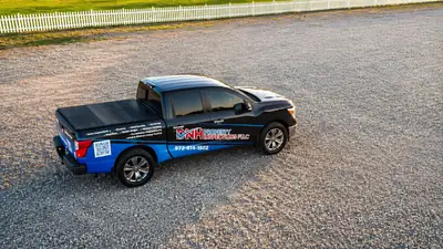 DNH Property Inspections branded pickup truck