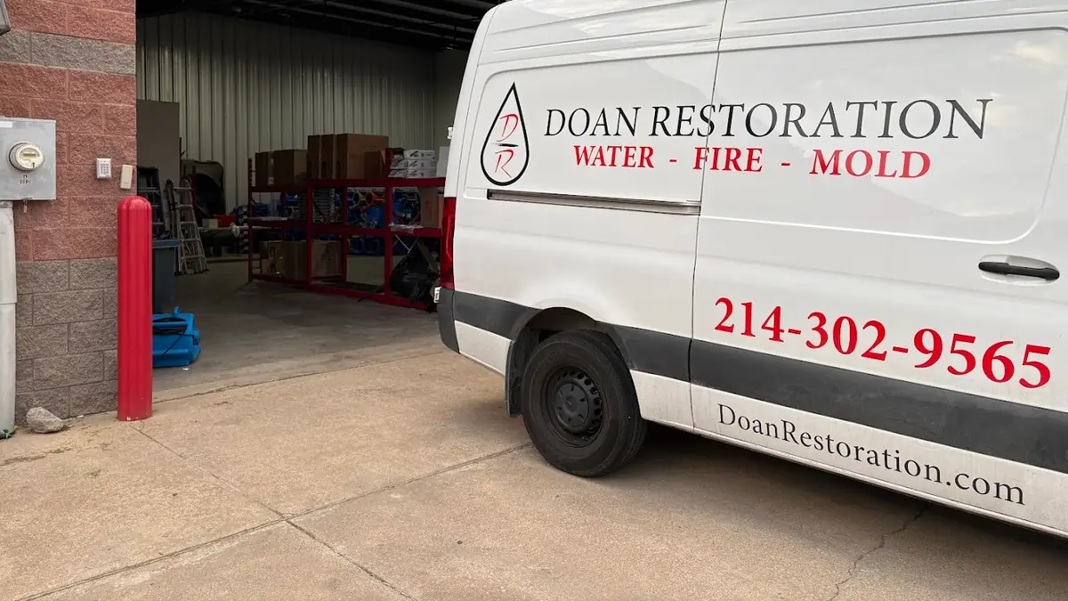 Doan Restoration of Dallas branded van in a warehouse bay