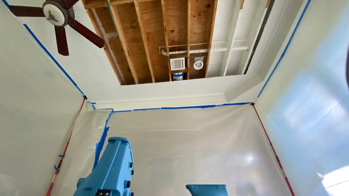 Ceiling opened with air movers drying the room