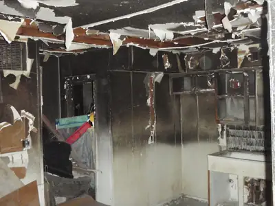 Badly damaged interior with collapsed ceiling material