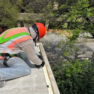 Worker in high-visibility gear on a job site