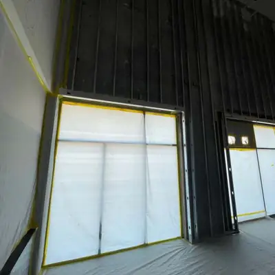 Wall stripped back next to windows