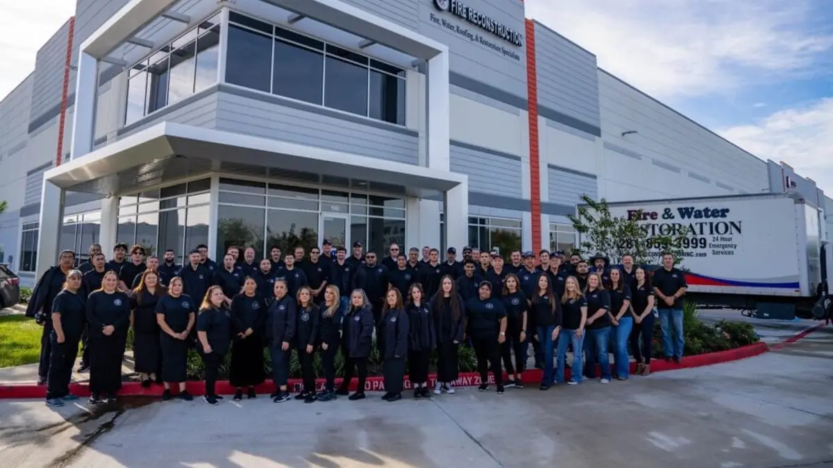 The Fire Reconstruction Inc. (FRI) team in front of the company building