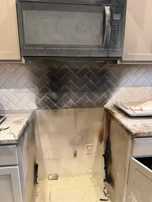 Fire-damaged kitchen before restoration