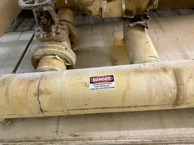 Pipe insulation tagged with a warning label