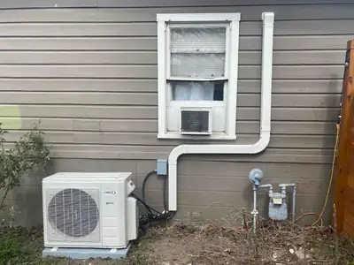 Ductless mini-split unit on an exterior wall