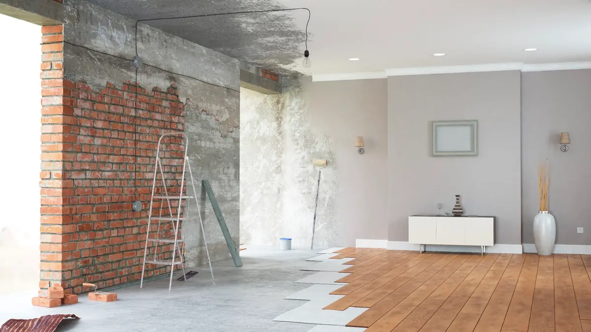 Room with a brick wall exposed during renovation