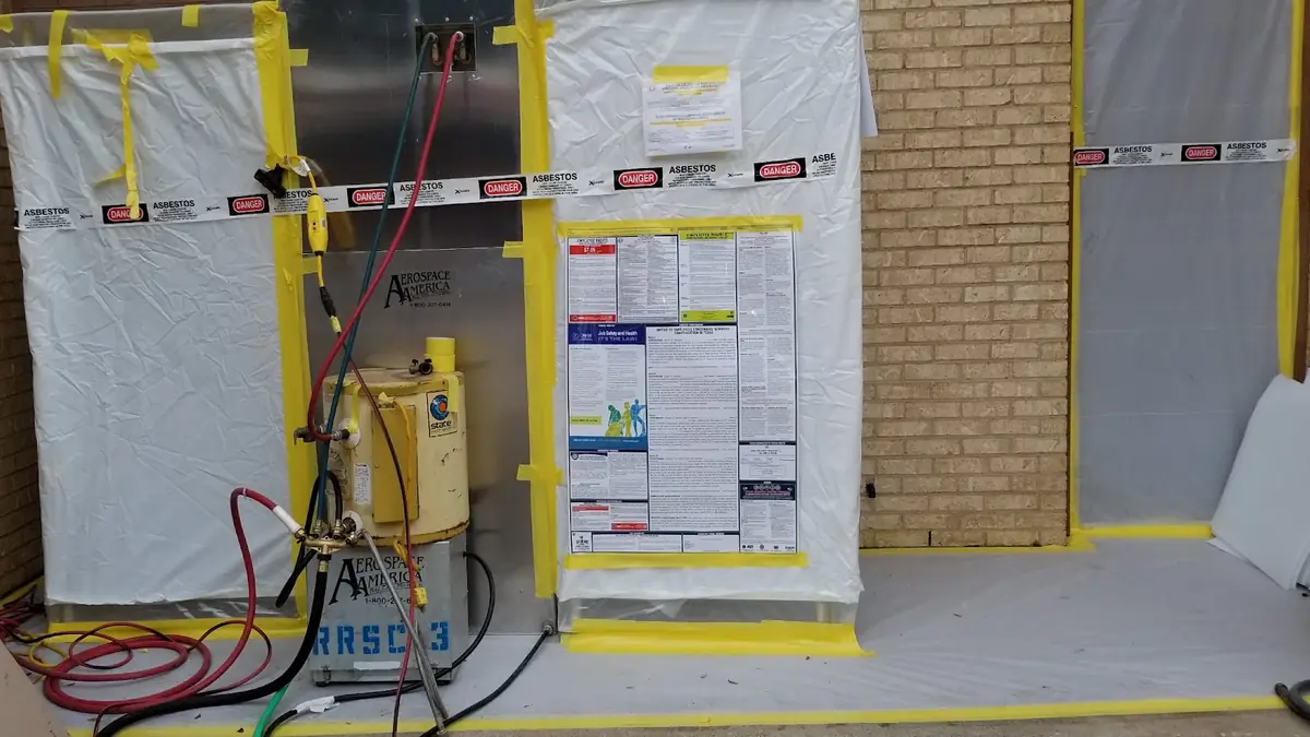 Asbestos work area with warning signs