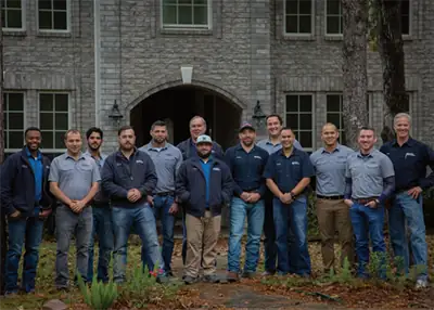 The Hedderman Services team outside a stone building