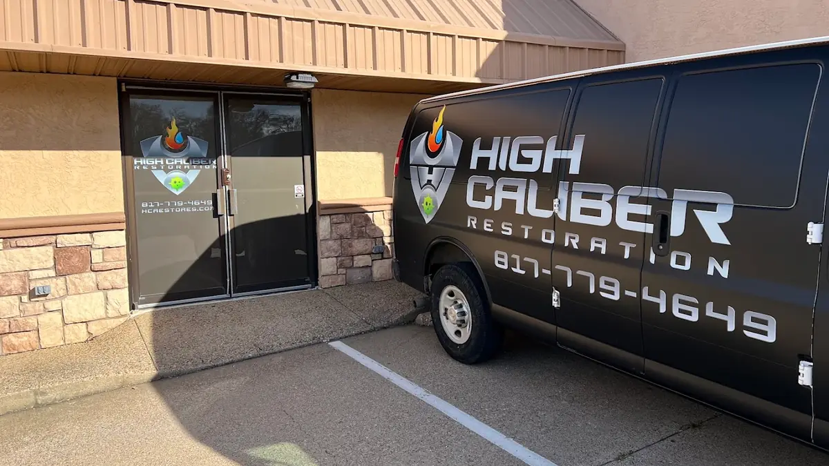 High Caliber Restoration branded van outside the office