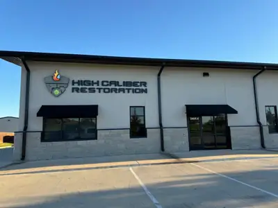 High Caliber Restoration building with signage