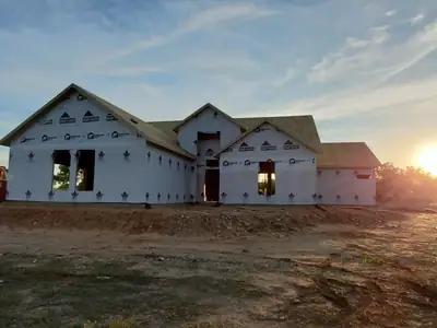 House under construction at sunset