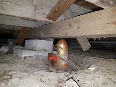 Crawlspace with exposed plumbing
