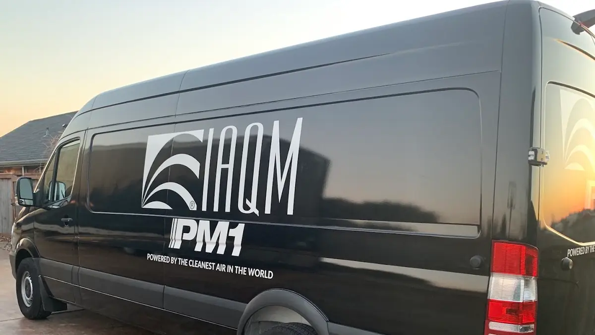 IAQM branded black van