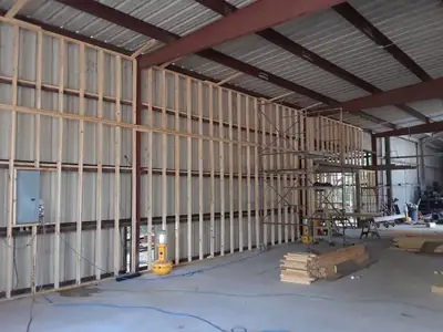 Long wall stripped to studs