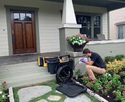 Inspector checking the exterior of a home