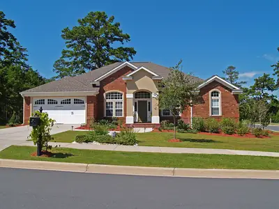 Brick home with a landscaped front yard
