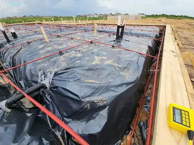 Foundation forms and vapour barrier before a pour