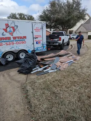 Lone Star Restoration trailer loaded with debris