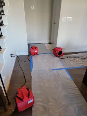 Air mover drying a hallway
