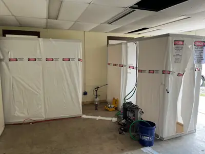 Room sealed with containment sheeting