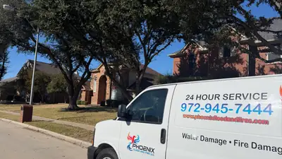 Phoenix Flood and Fire LLC van parked in a driveway
