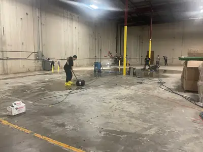 Bare warehouse floor during cleanup
