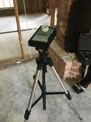 Air sampling pump on a tripod in a room