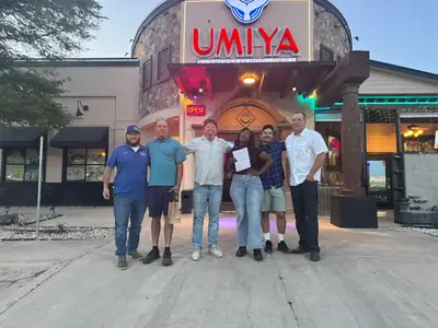 Priority Inspection Services team outside a restaurant client