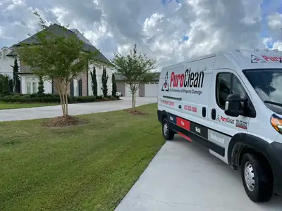 PuroClean van parked outside a home