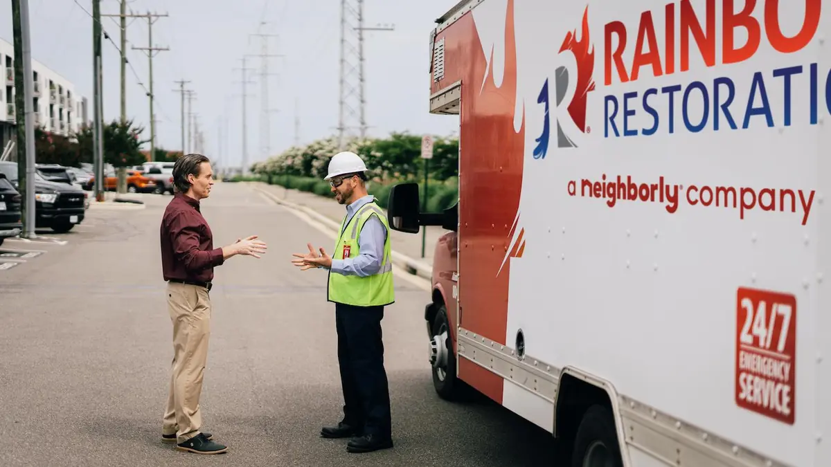 Rainbow Restoration truck with technicians on site
