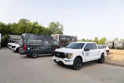 Fleet of R&L Restoration trucks