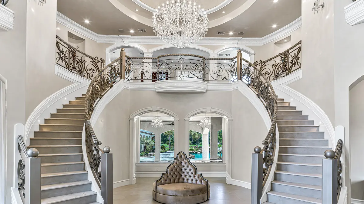 Twin curved staircase in a finished luxury home