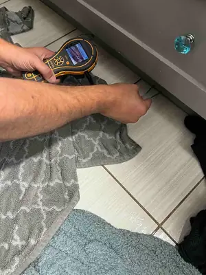 Moisture meter on a floor