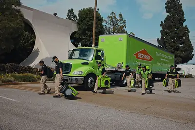 SERVPRO crew and green truck at a job